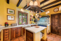 Kitchen with island and Lacache range cooker